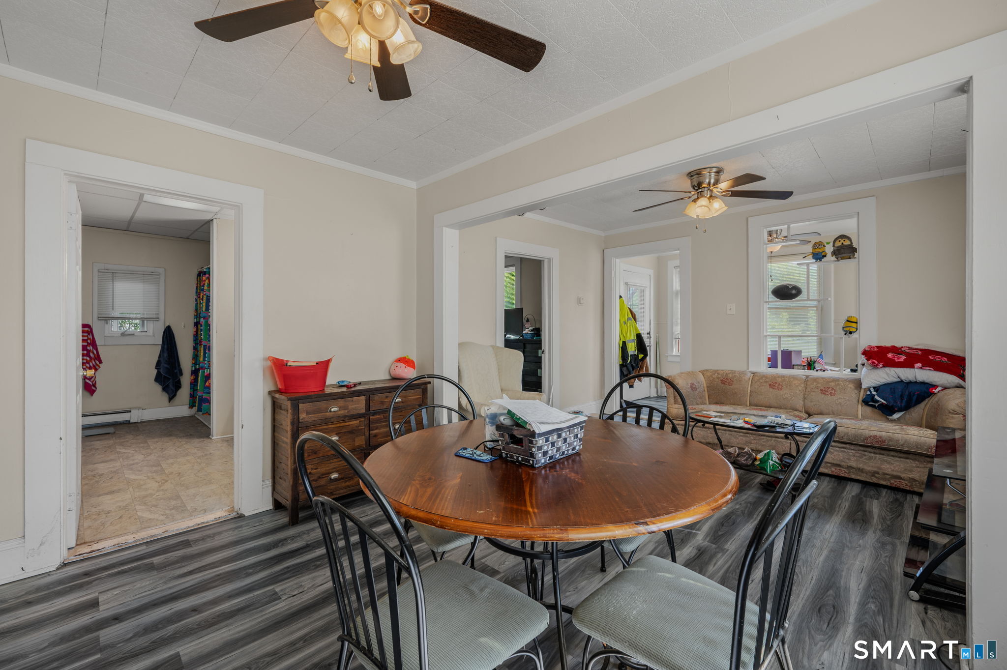 231 Poquonnock Road Groton, CT 06340 - Photo 7 of 30 a view of a dining room with furniture and wooden floor