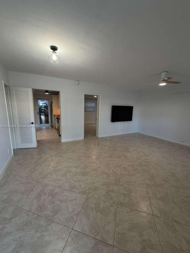 3208 Colony Club Road, Unit 2 Pompano Beach, FL 33062 - Photo 7 of 18 a view of an empty room with a window