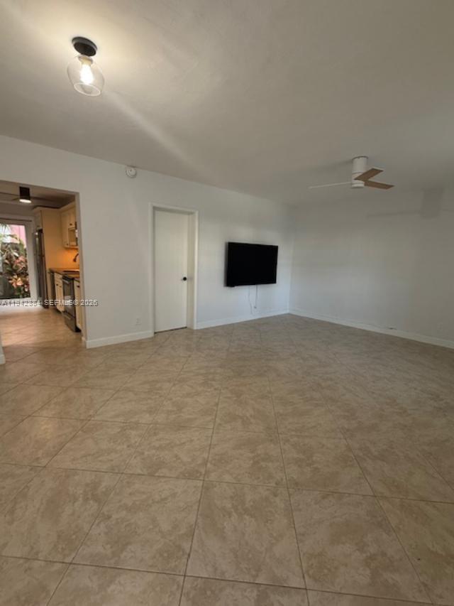 3208 Colony Club Road, Unit 2 Pompano Beach, FL 33062 - Photo 8 of 18 an empty room with natural light
