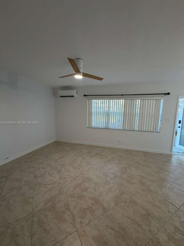 3208 Colony Club Road, Unit 2 Pompano Beach, FL 33062 - Photo 9 of 18 an empty room with windows