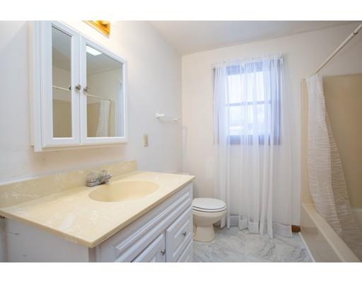 152 Starling Road Springfield, MA 01119 - Photo 14 of 28 a bathroom with a sink toilet a mirror and vanity