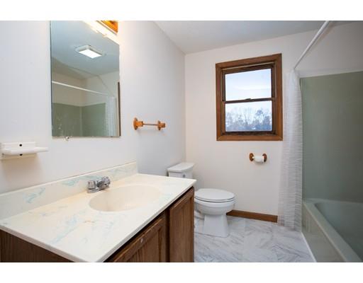 152 Starling Road Springfield, MA 01119 - Photo 20 of 28 a bathroom with a sink a toilet and mirror