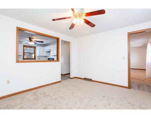 152 Starling Road Springfield, MA 01119 - Photo 9 of 28 a view of a livingroom with a ceiling fan and window
