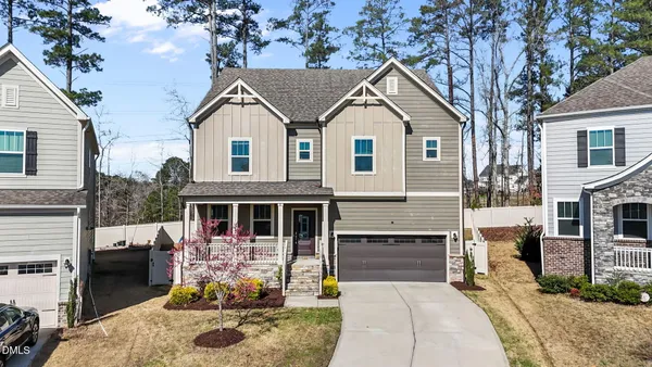 front view of a house with a yard