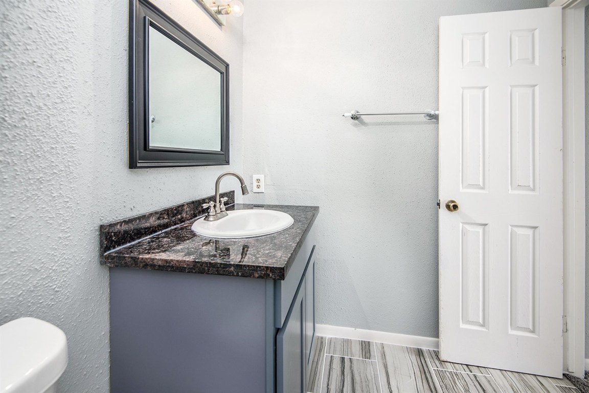 3085 Walnut Bend Lane, Unit 35 Houston, TX 77042 - Photo 14 of 23 a sink and a mirror