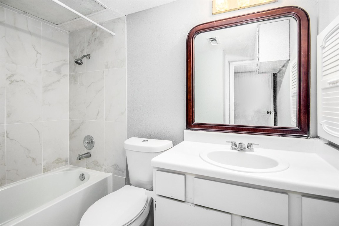 3085 Walnut Bend Lane, Unit 35 Houston, TX 77042 - Photo 16 of 23 a bathroom with a sink toilet and shower