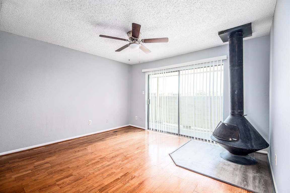 3085 Walnut Bend Lane, Unit 35 Houston, TX 77042 - Photo 2 of 23 a view of a livingroom with wooden floor and a window