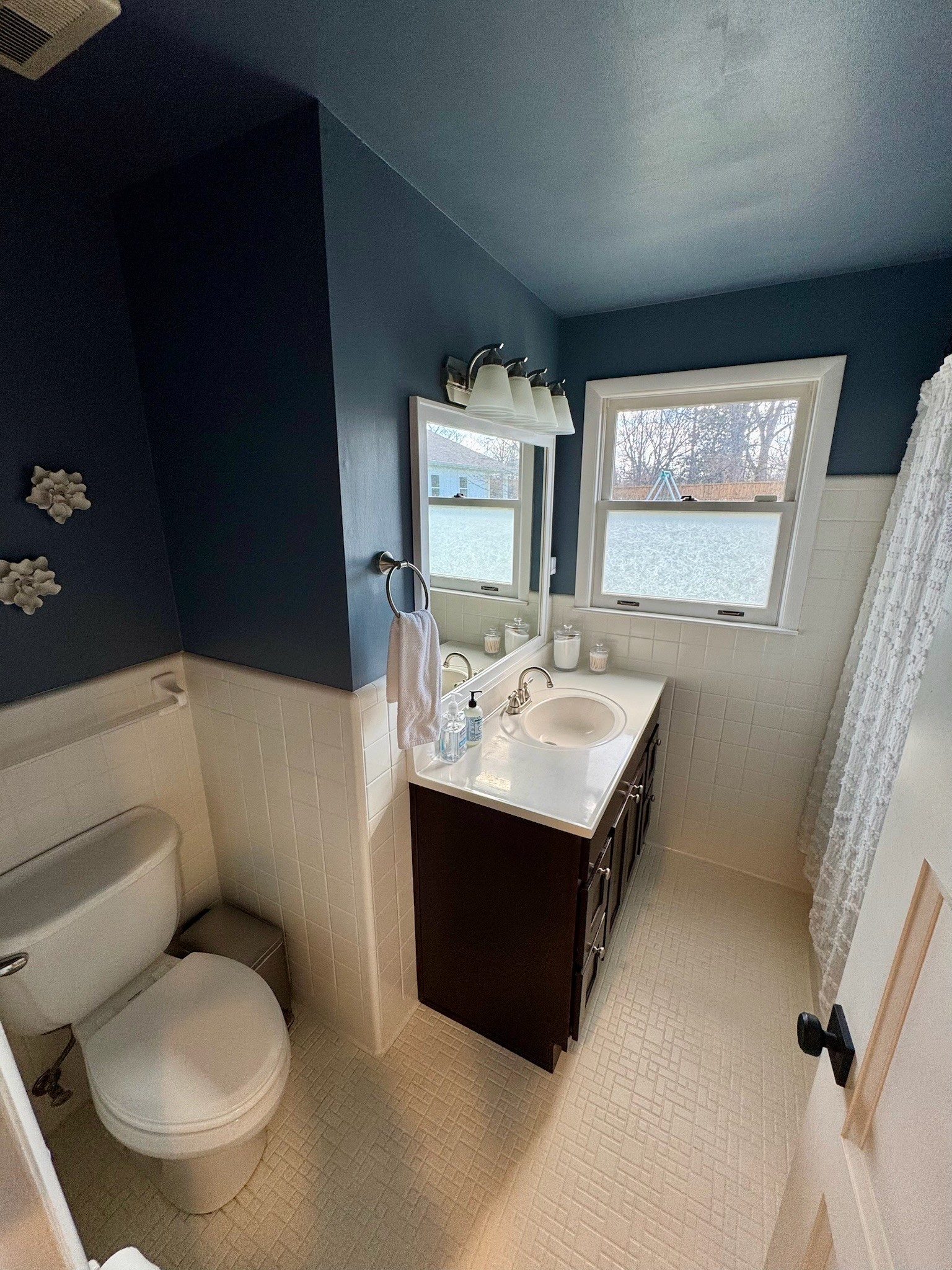 347 Blackman Road Nashville, TN 37211 - Photo 14 of 18 a bathroom with a toilet sink and mirror