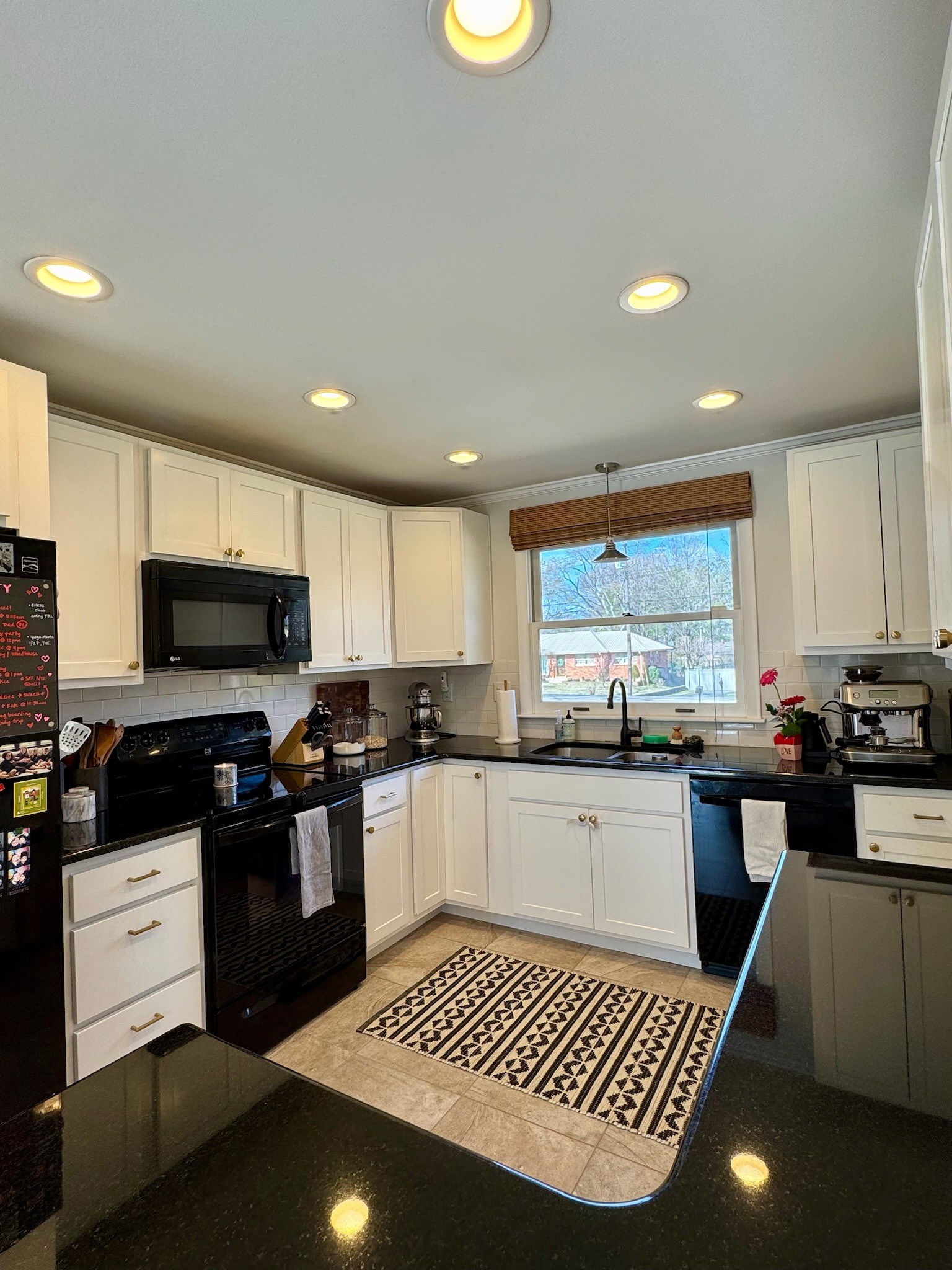 347 Blackman Road Nashville, TN 37211 - Photo 7 of 18 a kitchen with stainless steel appliances granite countertop a stove top oven a sink a counter space and cabinets