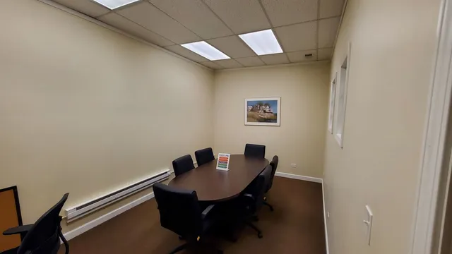 a view of a workspace with furniture