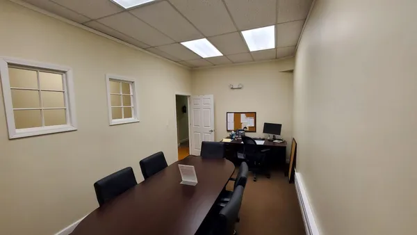 a view of workspace with wooden wall