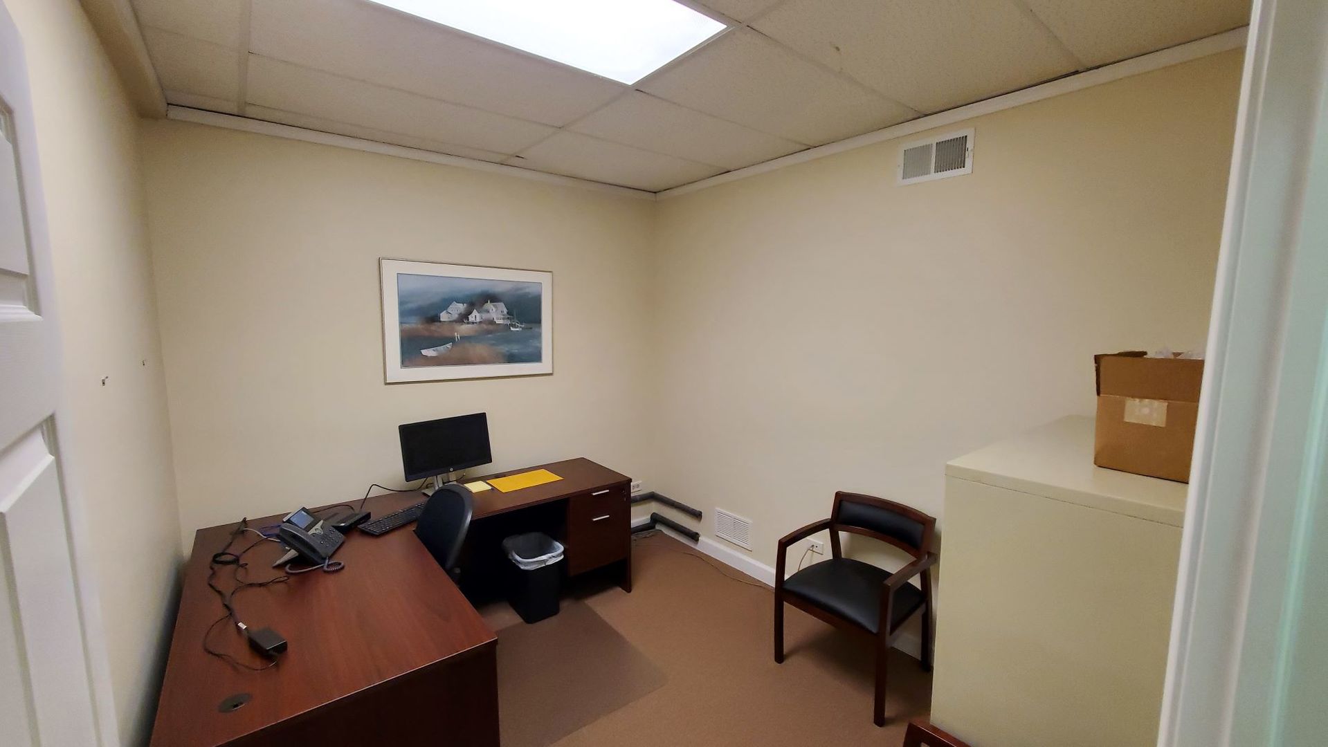 137 Cedar Avenue, Unit B Lake Villa, IL 60046 - Photo 9 of 11 a view of workspace with wooden wall