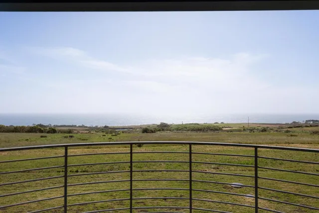 a living room with a couch and a large window
