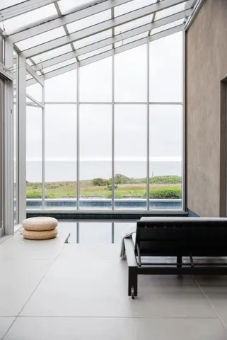 a view of a living room and bathroom