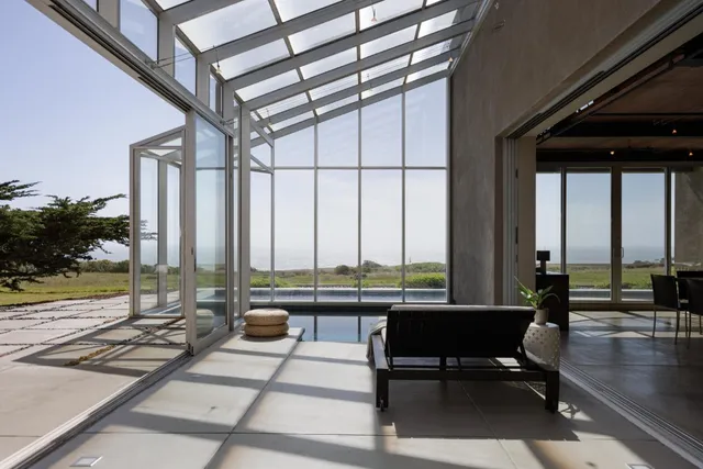 a view of a living room with a floor to ceiling window