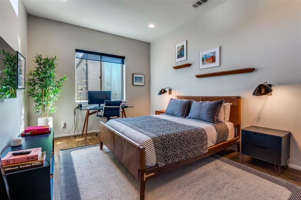 2012 Matilda Street Dallas, TX 75206 - Photo 15 of 24 a spacious bedroom with a bed and potted plants on the dresser