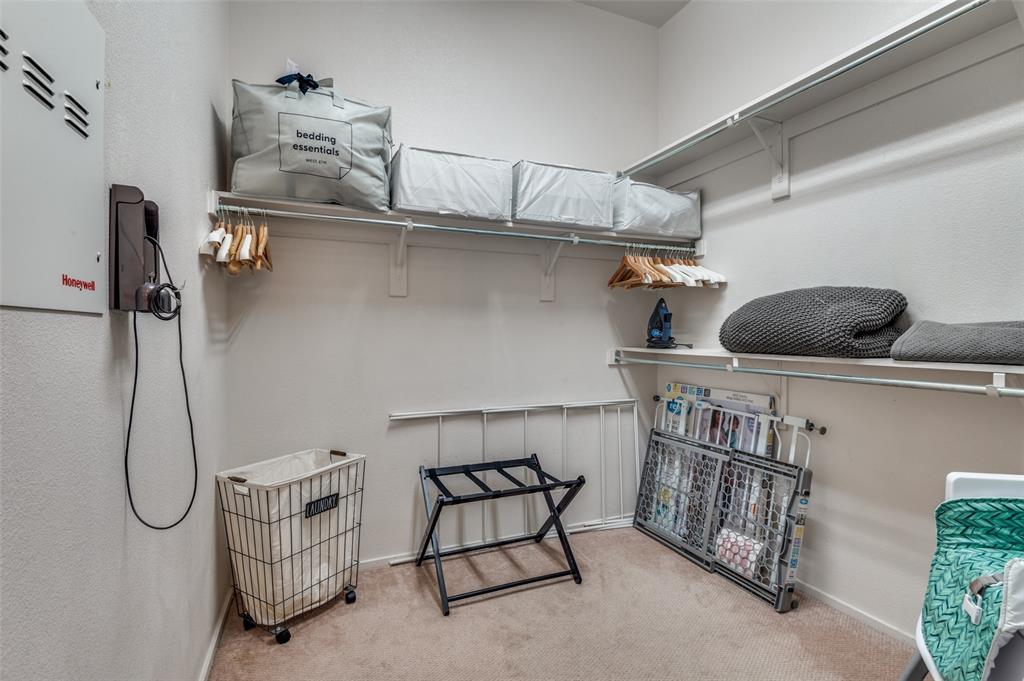 2012 Matilda Street Dallas, TX 75206 - Photo 16 of 24 a bedroom with a walk in closet and a window