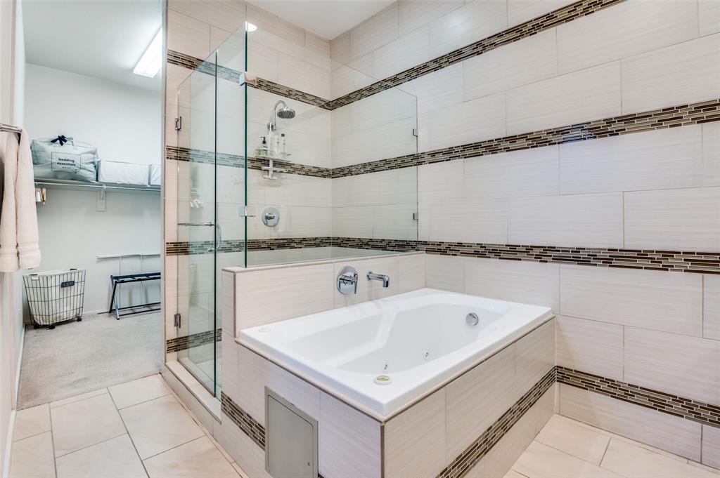 2012 Matilda Street Dallas, TX 75206 - Photo 18 of 24 a bathroom with a bathtub and a shower