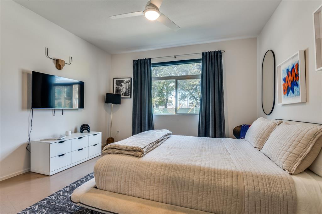 2012 Matilda Street Dallas, TX 75206 - Photo 21 of 24 a bedroom with a bed and a flat screen tv