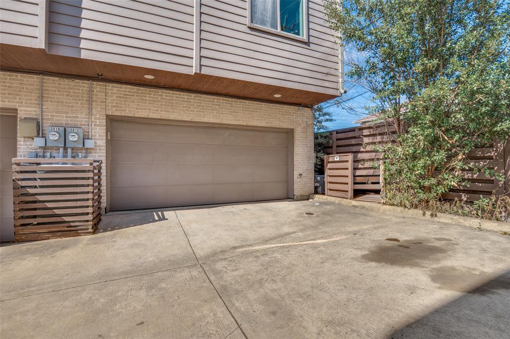 2012 Matilda Street Dallas, TX 75206 - Photo 24 of 24 a backyard of a house with wooden fence and a large tree