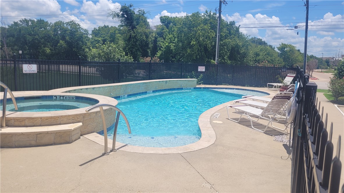 301 Southwest Parkway, Unit 304 College Station, TX 77840 - Photo 11 of 12 a view of a backyard with swimming pool