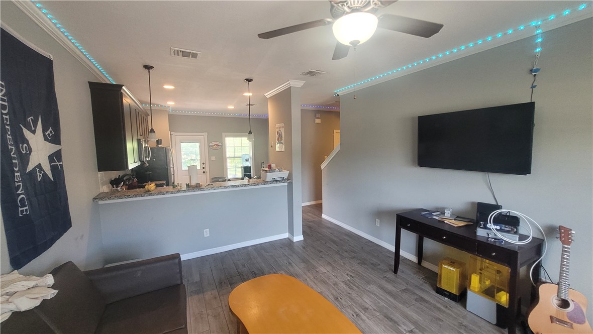 301 Southwest Parkway, Unit 304 College Station, TX 77840 - Photo 2 of 12 a living room with furniture and a flat screen tv