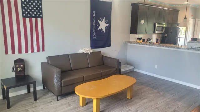 a living room with furniture and a bathtub