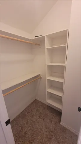 a view of an empty walk in closet