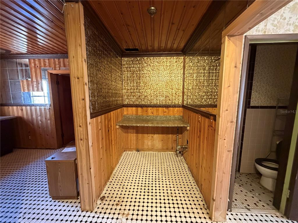 9602 North Taylor Road Seffner, FL 33584 - Photo 12 of 24 a view of a door with wooden floor