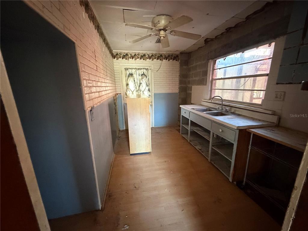 9602 North Taylor Road Seffner, FL 33584 - Photo 15 of 24 a room with furniture a window and a ceiling fan