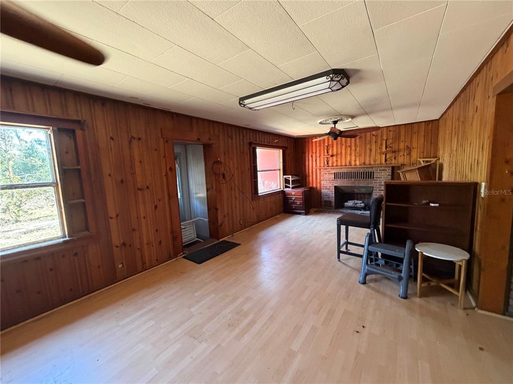 9602 North Taylor Road Seffner, FL 33584 - Photo 18 of 24 a view of a livingroom with furniture and a window