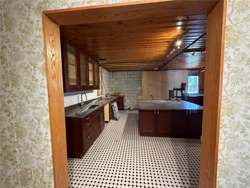 9602 North Taylor Road Seffner, FL 33584 - Photo 10 of 24 a kitchen with stainless steel appliances granite countertop a stove a sink dishwasher and a refrigerator