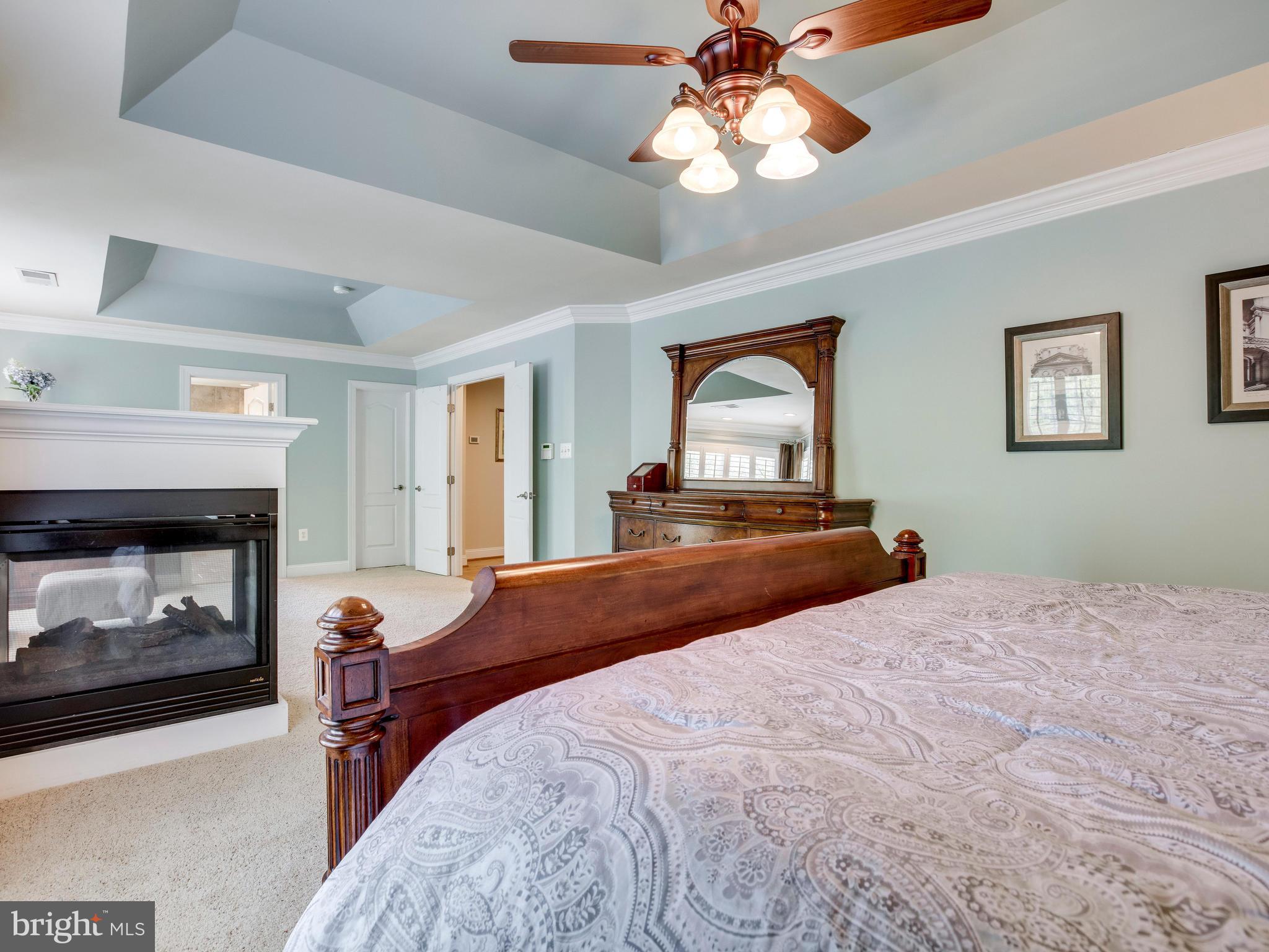8537 Riverside Road Alexandria, VA 22308 - Photo 20 of 30 a bedroom with a bed and a fireplace