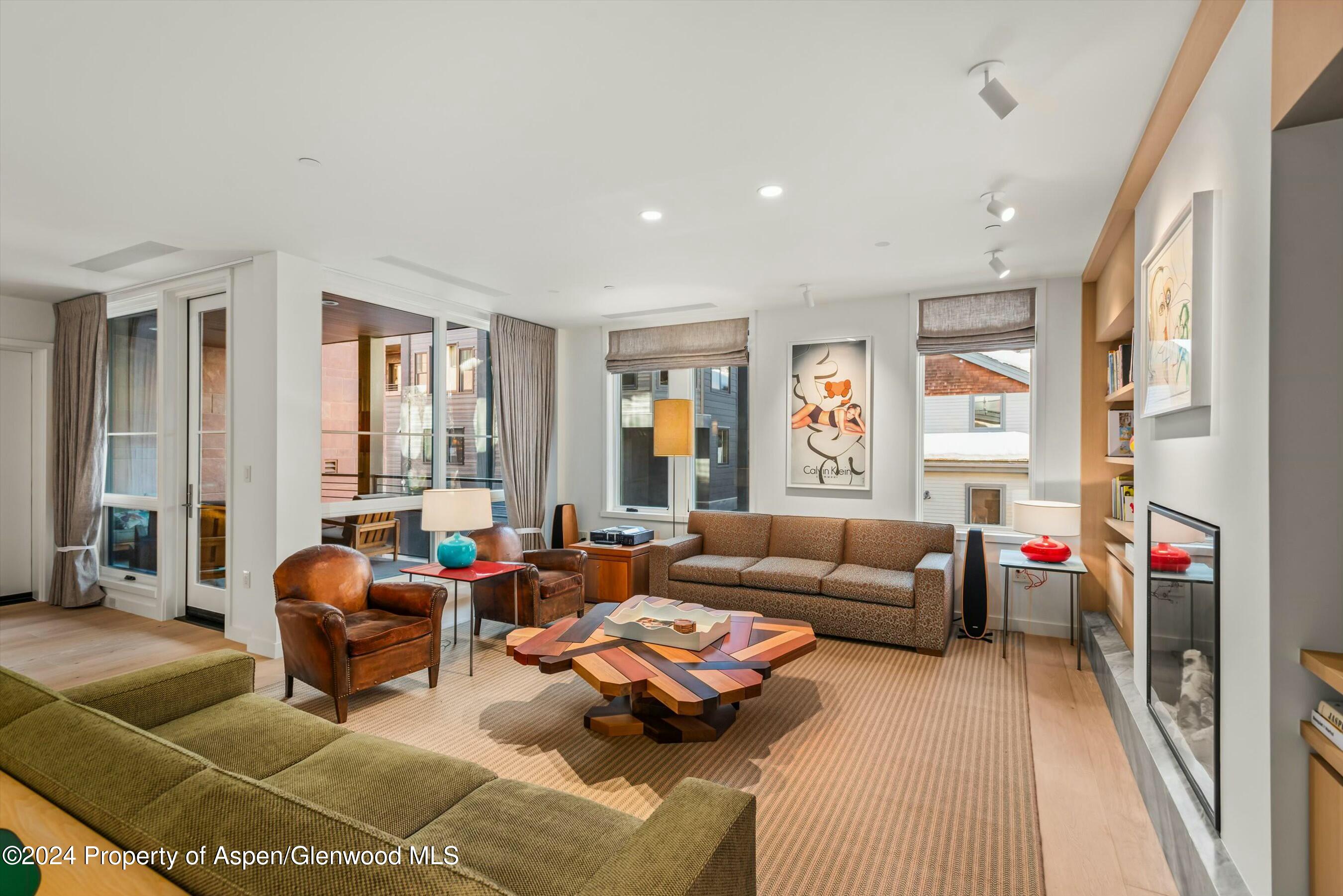 233 East Cooper Avenue, Unit 207 Aspen, CO 81611 - Photo 4 of 45 a living room with furniture and a large window