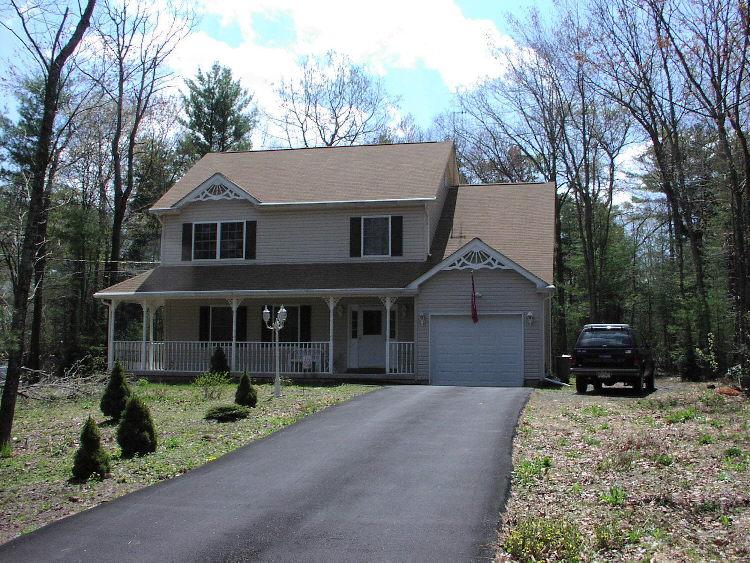 Lot 36 Haney Road Kunkletown, PA 18058 - Photo 1 of 7 a front view of a house with a yard and garage