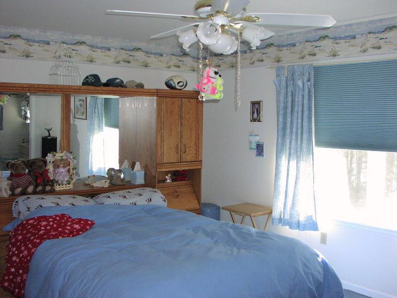 Lot 36 Haney Road Kunkletown, PA 18058 - Photo 6 of 7 a bedroom with a bed and a chandelier