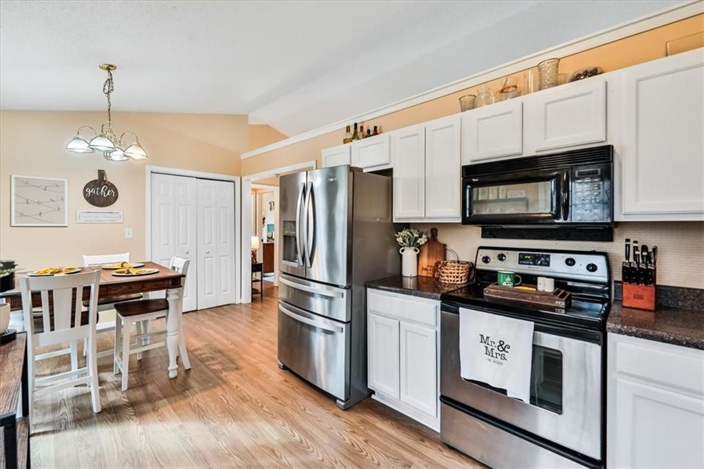 385 Prometheous Way Rockmart, GA 30153 - Photo 11 of 27 a kitchen with stainless steel appliances a stove a sink and a refrigerator