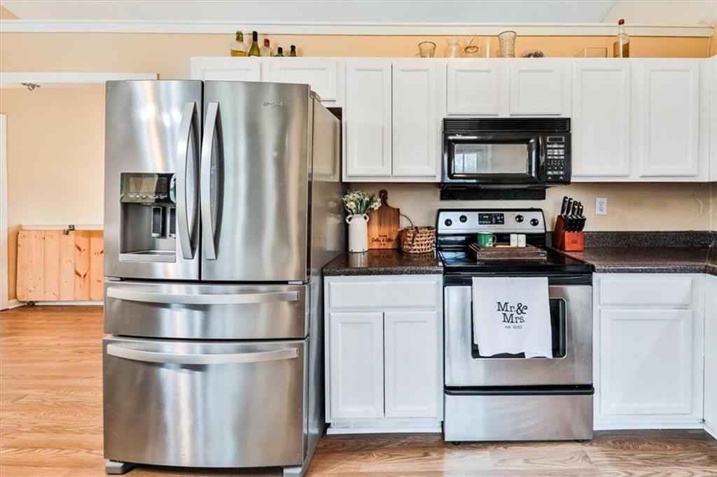 385 Prometheous Way Rockmart, GA 30153 - Photo 12 of 27 a kitchen with stainless steel appliances a refrigerator stove microwave and sink