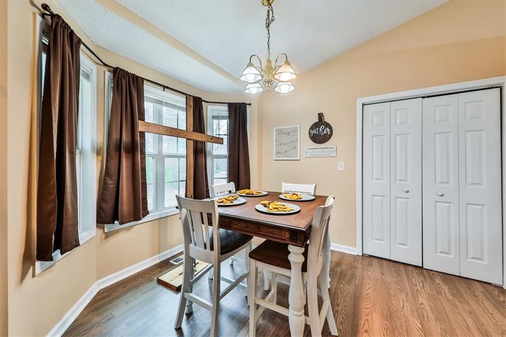 385 Prometheous Way Rockmart, GA 30153 - Photo 13 of 27 a view of a dining room with furniture window and wooden floor