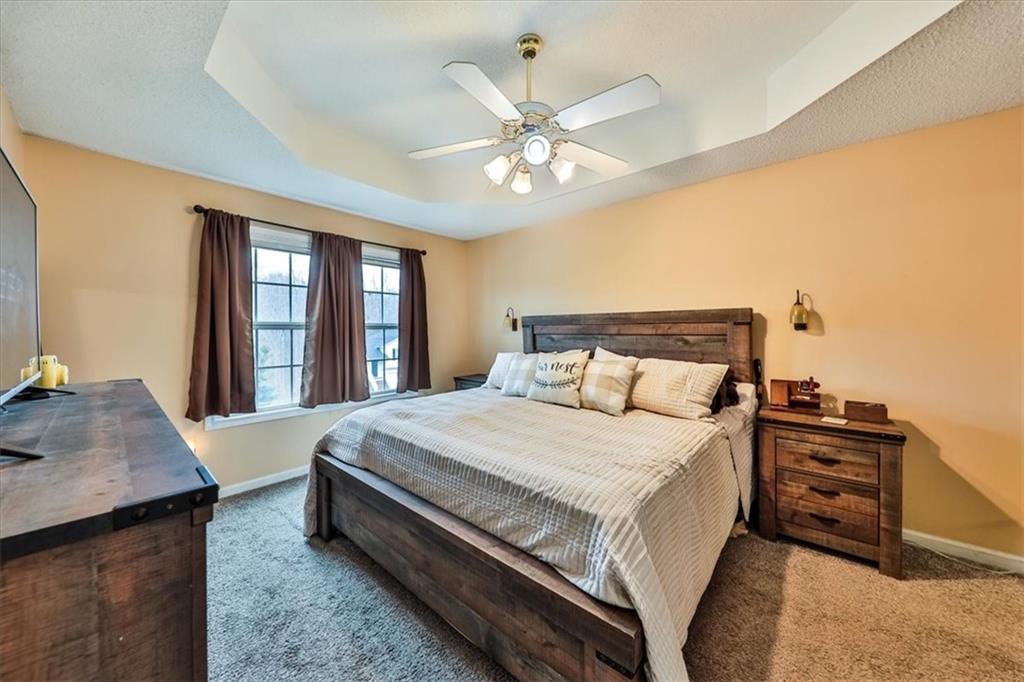 385 Prometheous Way Rockmart, GA 30153 - Photo 14 of 27 a bedroom with a large bed and a dresser