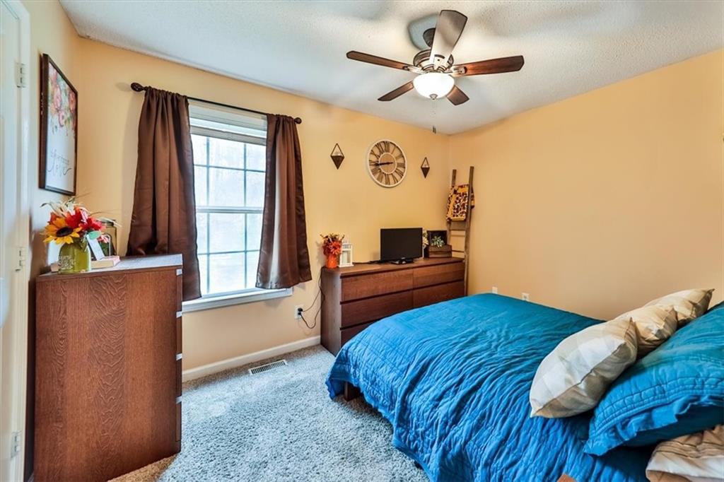 385 Prometheous Way Rockmart, GA 30153 - Photo 17 of 27 a bedroom with a bed dresser and a window