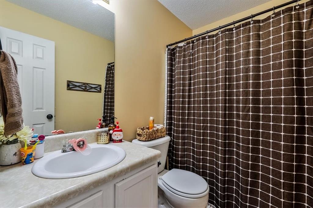 385 Prometheous Way Rockmart, GA 30153 - Photo 18 of 27 a bathroom with a sink a toilet and a mirror