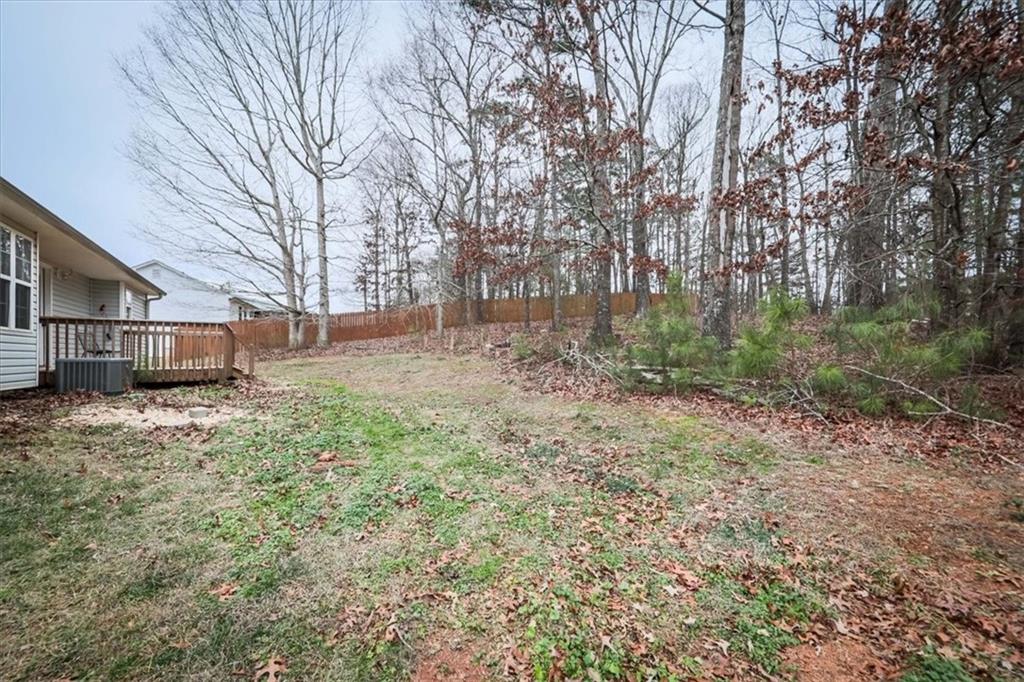 385 Prometheous Way Rockmart, GA 30153 - Photo 26 of 27 a view of a yard with a house and tree s