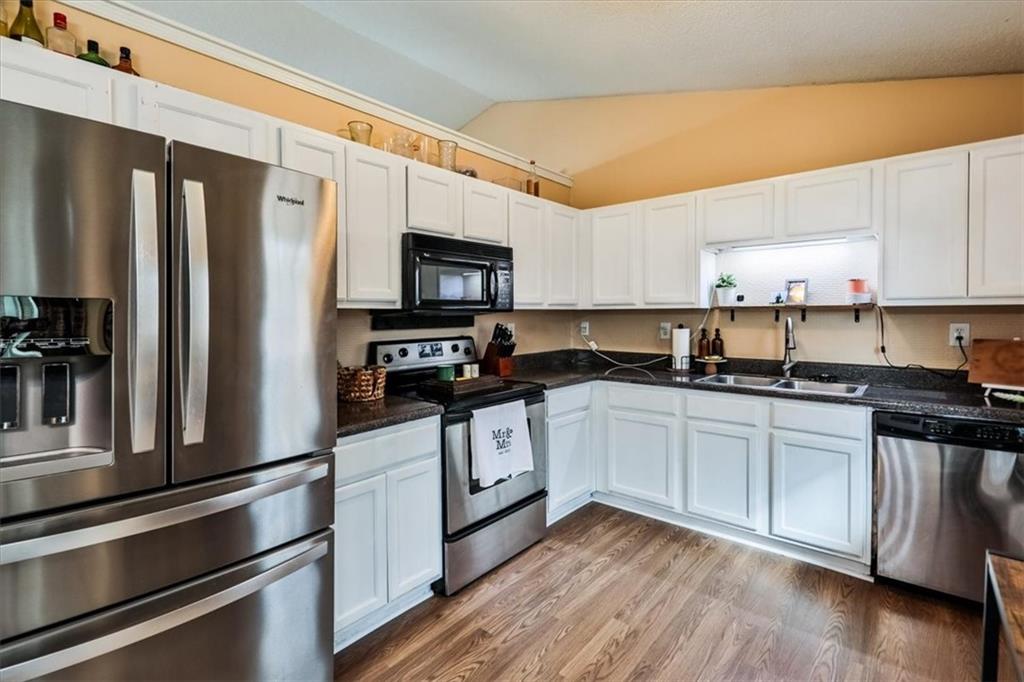 385 Prometheous Way Rockmart, GA 30153 - Photo 10 of 27 a kitchen with stainless steel appliances a refrigerator stove and sink