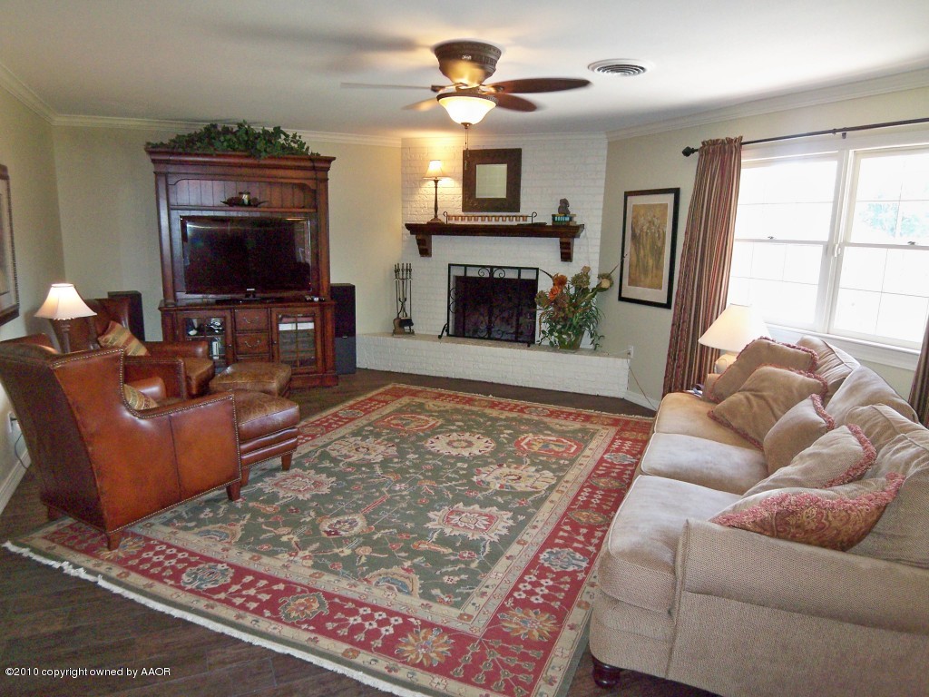 6301 Elmhurst Road Amarillo, TX 79106 - Photo 8 of 20 a living room with furniture and a fireplace