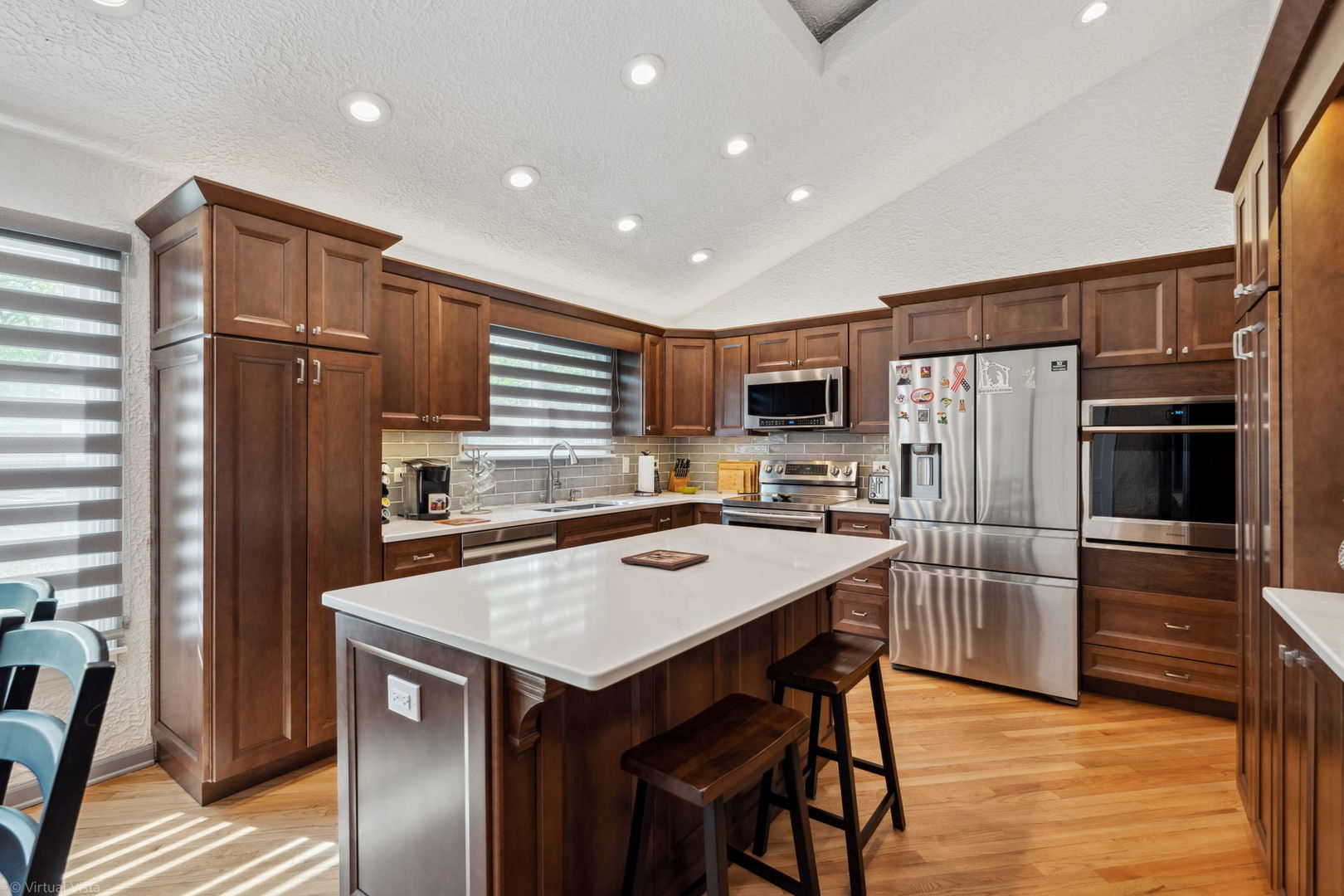 396 Jervey Lane Bartlett, IL 60103 - Photo 14 of 39 a kitchen with stainless steel appliances a refrigerator and a stove top oven