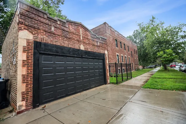 a view of a house with a small space next to a road
