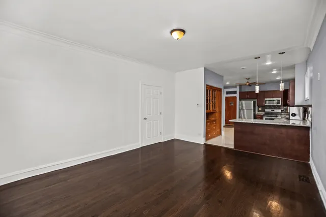 a view of kitchen and wooden floor