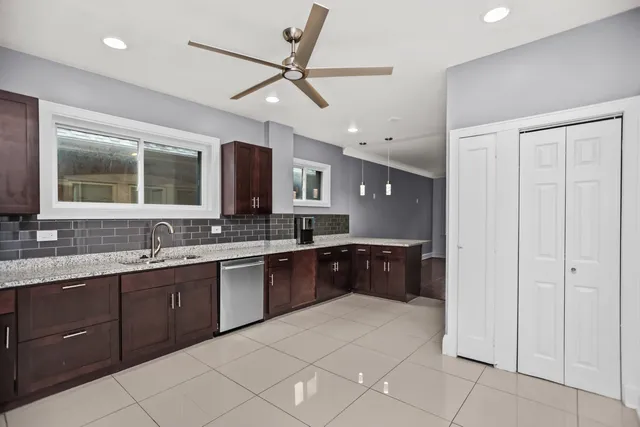 a large bathroom with a large tub sink and mirror