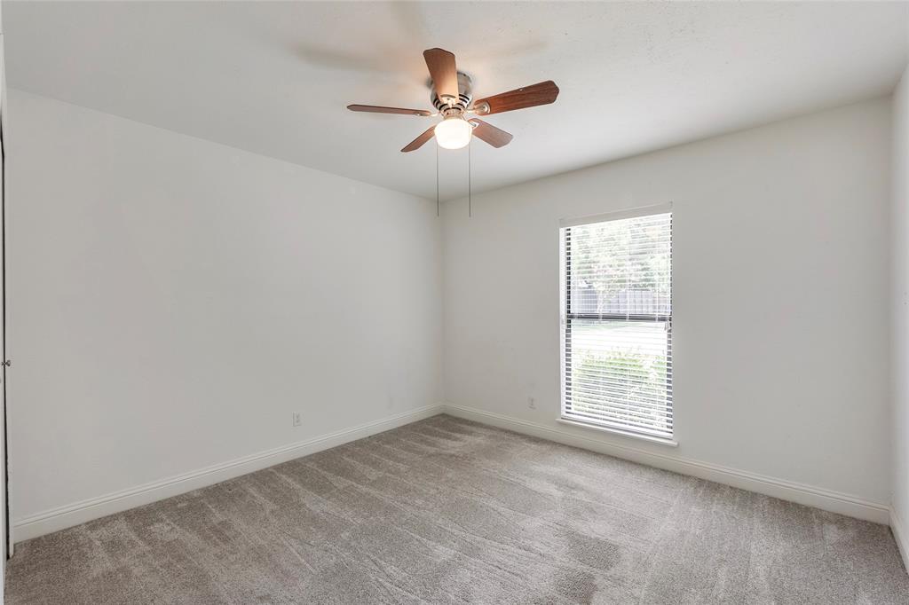 2004 White Ash Road Carrollton, TX 75007 - Photo 22 of 40 Bedroom #2 with ceiling fan and closet